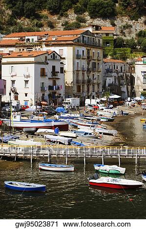 Stock Image - High angle view of boats at a harbor, Marina Grande, Capri, Sorrento, Sorrentine Peninsula, Naples Province, Campania, Italy. Fotosearch