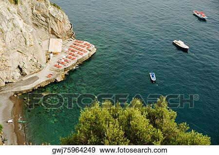 High angle view of boats floating on water, Spiaggia San Pietro, Costiera Amalfitana, Salerno, Campania, Italy View Large Photo Image Stock Photo - High angle view of boats floating on water, Spiaggia San Pietro, Costiera Amalfitana, Salerno, Campania, Italy. Fotosearch