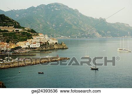 Stock Photograph - High angle view of boats floating on water, Costiera Amalfitana, Amalfi, Salerno, Campania, Italy. Fotosearch