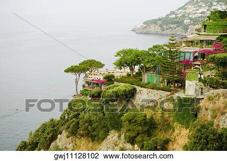 High angle view of buildings at the hillside, Costiera Amalfitana, Salerno, Campania, Italy View Large Photo Image Stock Image - High angle view of buildings at the hillside, Costiera Amalfitana, Salerno, Campania, Italy. Fotosearch