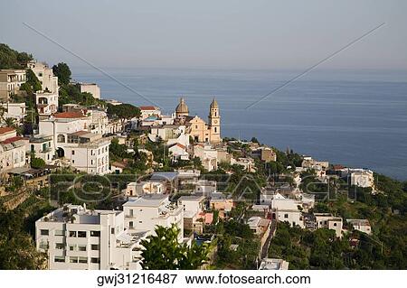 High angle view of buildings in a town with a church in the background, Parrocchiale di San Gennaro, Amalfi Coast, Maiori, Salerno, Campania, Italy View Large Photo Image Stock Photo - High angle view of buildings in a town with a church in the background, Parrocchiale di San Gennaro, Amalfi Coast, Maiori, Salerno, Campania, Italy. Fotosearch