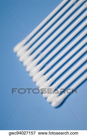 High angle view of cotton swabs on a blue background View Large Photo Image Stock Photo - High angle view of cotton swabs on a blue background. Fotosearch