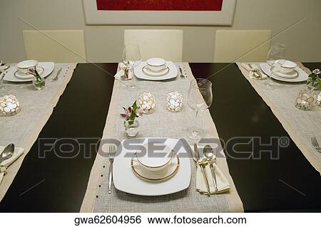 High angle view of place setting on a dining table View Large Photo Image Stock Photograph - High angle view of place setting on a dining table. Fotosearch