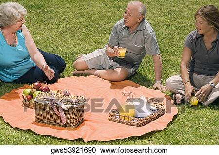 High angle view of three senior people at picnic View Large Photo Image Stock Image - High angle view of three senior people at picnic. Fotosearch