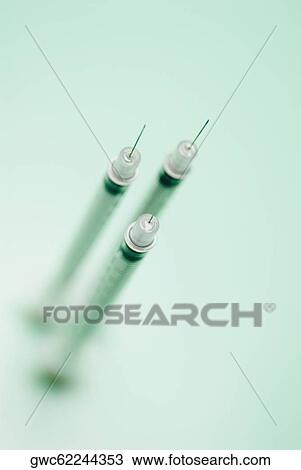 High angle view of three syringes View Large Photo Image Stock Image - High angle view of three syringes. Fotosearch