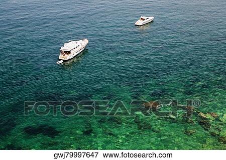 High angle view of tourboats in the sea, Bay of Naples, Sorrento, Sorrentine Peninsula, Naples Province, Campania, Italy View Large Photo Image Stock Photo - High angle view of tourboats in the sea, Bay of Naples, Sorrento, Sorrentine Peninsula, Naples Province, Campania, Italy. Fotosearch