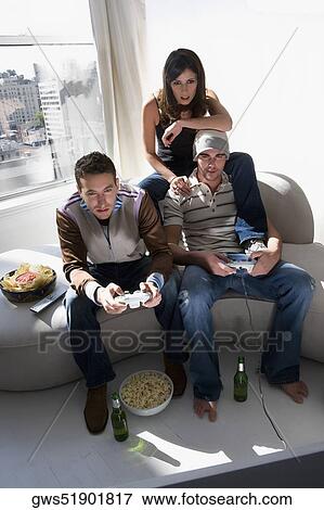 High angle view of two young men playing video game View Large Photo Image Stock Photo - High angle view of two young men playing video game. Fotosearch