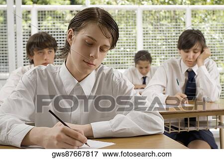High school students giving an exam in a classroom View Large Photo Image Stock Photo - High school students giving an exam in a classroom. Fotosearch