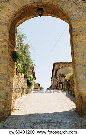 Houses viewed through an archway, Porta Franca, Monteriggioni, Siena Province, Tuscany, Italy View Large Photo Image Stock Image - Houses viewed through an archway, Porta Franca, Monteriggioni, Siena Province, Tuscany, Italy. Fotosearch