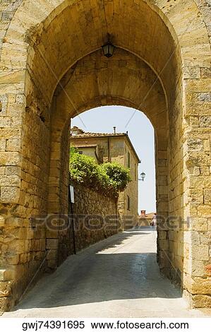 Houses viewed through an archway, Porta Franca, Monteriggioni, Siena Province, Tuscany, Italy View Large Photo Image Stock Photography - Houses viewed through an archway, Porta Franca, Monteriggioni, Siena Province, Tuscany, Italy. Fotosearch
