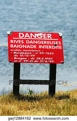 Stock Image - Information board at a lakeside, Bordeaux Lake, Bordeaux, Aquitaine, France. Fotosearch