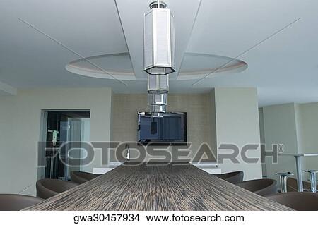 Picture - Lamp shades hanging over a table in a hotel. Fotosearch