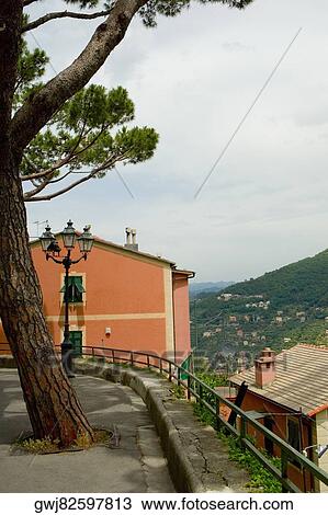 Stock Image - Lamppost in front of a house, Genoa Province, Liguria, Italy. Fotosearch