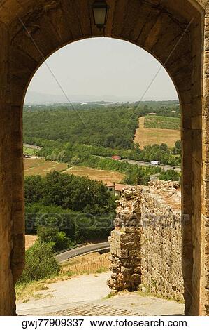 Landscape viewed through an archway, Porta Franca, Monteriggioni, Siena Province, Tuscany, Italy View Large Photo Image Stock Photo - Landscape viewed through an archway, Porta Franca, Monteriggioni, Siena Province, Tuscany, Italy. Fotosearch