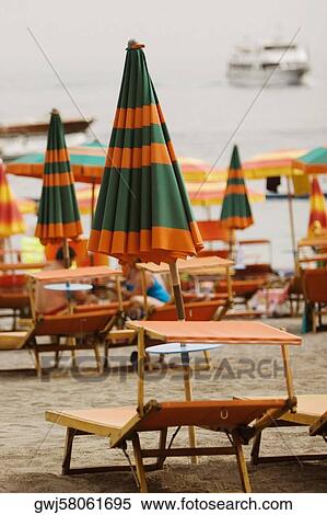 Lounge chairs with beach umbrellas on the beach, Spiaggia Grande, Positano, Amalfi Coast, Salerno, Campania, Italy View Large Photo Image Stock Photography - Lounge chairs with beach umbrellas on the beach, Spiaggia Grande, Positano, Amalfi Coast, Salerno, Campania, Italy. Fotosearch