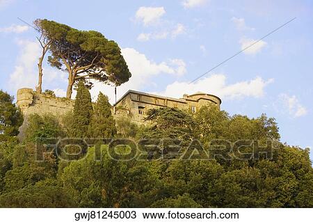 Stock Image - Low angle view of a castle on a hill, Italian Riviera, Genoa, Liguria, Italy. Fotosearch