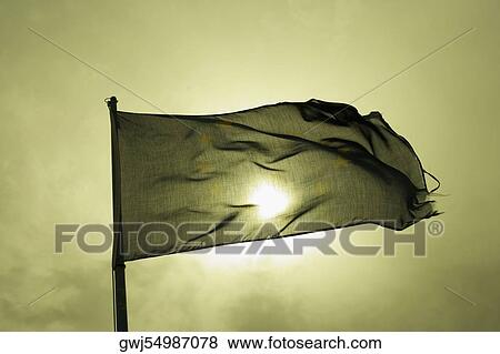 Stock Photo - Low angle view of a flag fluttering, Italian Riviera, Cinque Terre National Park, Mar Ligure, Cinque Terre, La Spezia, Liguria, Italy. Fotosearch