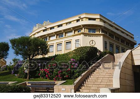 Stock Image - Low angle view of a formal garden in front of a building, Biarritz, Pyrenees-Atlantiques, Aquitaine, France. Fotosearch