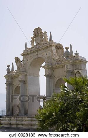 Stock Image - Low angle view of a fountain, La Fontana dell'Immacolatella, Naples, Naples Province, Campania, Italy. Fotosearch