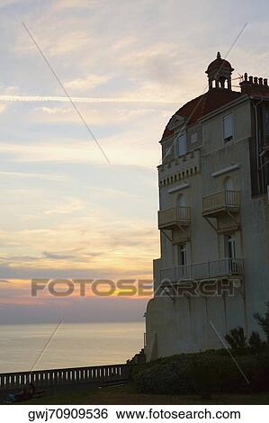 Stock Photograph - Low angle view of a hotel at the oceanside, Carrefour d'Helianthe, Biarritz, France. Fotosearch