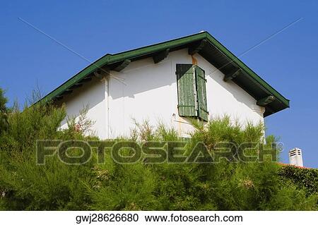Low angle view of a house, Biarritz, Basque Country, Pyrenees-Atlantiques, Aquitaine, France View Large Photo Image Stock Image - Low angle view of a house, Biarritz, Basque Country, Pyrenees-Atlantiques, Aquitaine, France. Fotosearch
