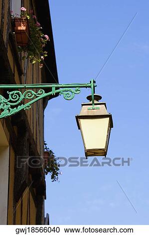 Low angle view of a lantern mounted on the wall, Le Mans, Sarthe, Pays-de-la-Loire, France View Large Photo Image Stock Image - Low angle view of a lantern mounted on the wall, Le Mans, Sarthe, Pays-de-la-Loire, France. Fotosearch