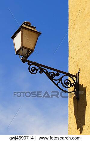 Low angle view of a lantern mounted on the wall, Le Mans, Sarthe, Pays-de-la-Loire, France View Large Photo Image Stock Image - Low angle view of a lantern mounted on the wall, Le Mans, Sarthe, Pays-de-la-Loire, France. Fotosearch