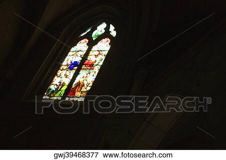 Low angle view of a stained glass window in a church, Church Of St. Pierre, Bordeaux, Aquitaine, France View Large Photo Image Stock Photo - Low angle view of a stained glass window in a church, Church Of St. Pierre, Bordeaux, Aquitaine, France. Fotosearch