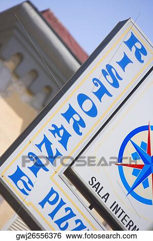 Stock Photograph - Low angle view of an information board, Naples, Naples Province, Campania, Italy. Fotosearch