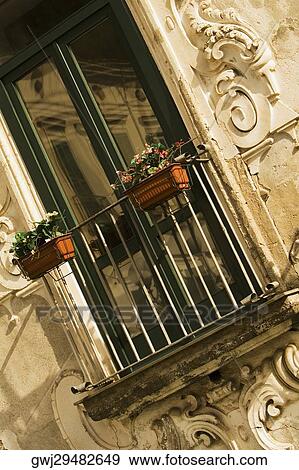 Low angle view of window boxes on a railing, Vietri Sul Mare, Costiera Amalfitana, Salerno, Campania, Italy View Large Photo Image Stock Photo - Low angle view of window boxes on a railing, Vietri Sul Mare, Costiera Amalfitana, Salerno, Campania, Italy. Fotosearch