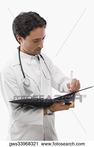 Male doctor writing in a file View Large Photo Image Stock Image - Male doctor writing in a file. Fotosearch