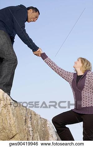 Mature man pulling a mature woman View Large Photo Image Stock Photograph - Mature man pulling a mature woman. Fotosearch