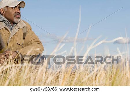 Stock Photograph - Mature man resting. Fotosearch