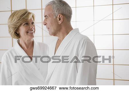 Mature woman and a senior man standing in the bathroom View Large Photo Image Stock Photo - Mature woman and a senior man standing in the bathroom. Fotosearch
