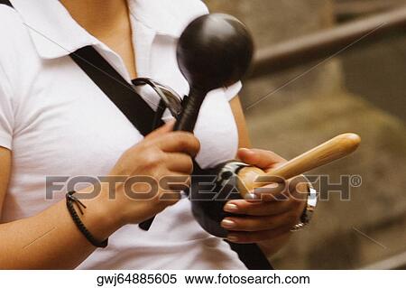 Mid section view of a woman holding maracas, Via Padre Reginaldo Giuliani, Sorrento, Sorrentine Peninsula, Naples Province, Campania, Italy View Large Photo Image Stock Photography - Mid section view of a woman holding maracas, Via Padre Reginaldo Giuliani, Sorrento, Sorrentine Peninsula, Naples Province, Campania, Italy. Fotosearch