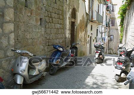 Mopeds parked in front of buildings, Sorrento, Sorrentine Peninsula, Naples Province, Campania, Italy View Large Photo Image Stock Image - Mopeds parked in front of buildings, Sorrento, Sorrentine Peninsula, Naples Province, Campania, Italy. Fotosearch