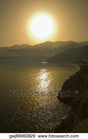 Panoramic view of the sunset, Costiera Amalfitana, Salerno, Campania, Italy View Large Photo Image Stock Photo - Panoramic view of the sunset, Costiera Amalfitana, Salerno, Campania, Italy. Fotosearch