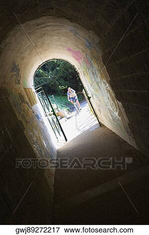 Person riding a bicycle viewed through an archway, Pont Yssoir, Le Mans, Sarthe, France View Large Photo Image Stock Photo - Person riding a bicycle viewed through an archway, Pont Yssoir, Le Mans, Sarthe, France. Fotosearch