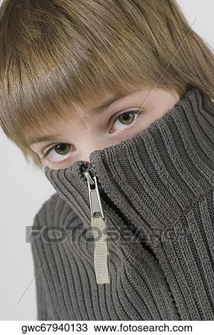 Portrait of a boy hiding his face View Large Photo Image Stock Image - Portrait of a boy hiding his face. Fotosearch
