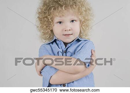 Portrait of a boy posing View Large Photo Image Stock Image - Portrait of a boy posing. Fotosearch