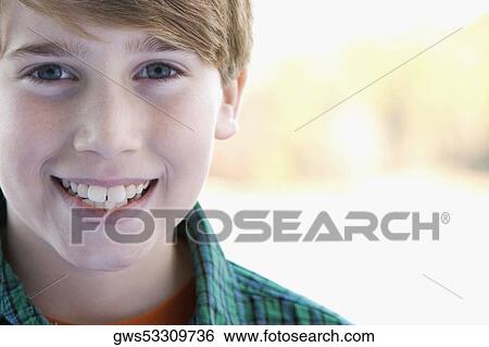 Stock Photograph - Portrait of a boy smiling. Fotosearch
