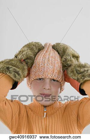 Portrait of a boy with his hands on his head View Large Photo Image Stock Photo - Portrait of a boy with his hands on his head. Fotosearch