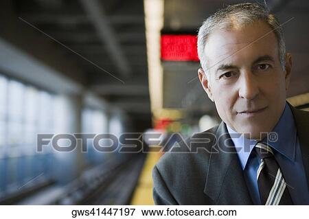 Stock Photo - Portrait of a businessman grinning. Fotosearch