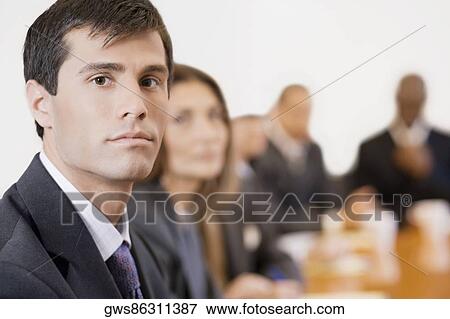 Portrait of a businessman in a board room View Large Photo Image Stock Photo - Portrait of a businessman in a board room. Fotosearch
