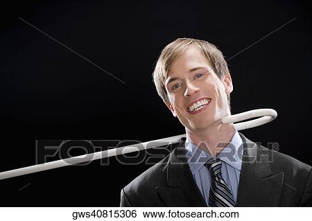 Portrait of a businessman smiling and being pulled by a cane View Large Photo Image Stock Photograph - Portrait of a businessman smiling and being pulled by a cane. Fotosearch