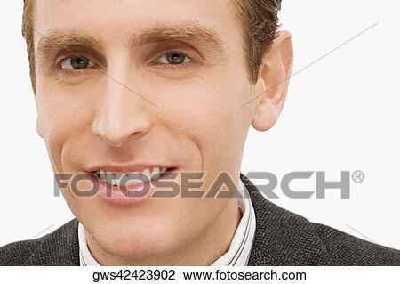 Stock Image - Portrait of a businessman smiling. Fotosearch