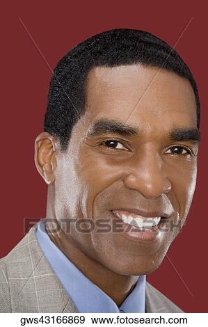 Portrait of a businessman smiling View Large Photo Image Stock Photo - Portrait of a businessman smiling. Fotosearch