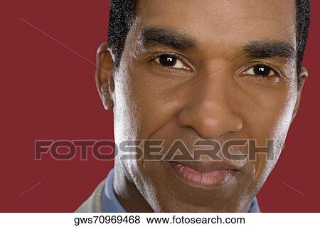 Portrait of a businessman smiling View Large Photo Image Stock Photo - Portrait of a businessman smiling. Fotosearch