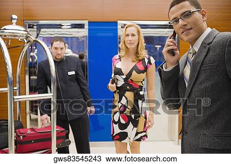 Stock Image - Portrait of a businessman talking on a mobile phone. Fotosearch