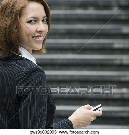 Portrait of a businesswoman text messaging View Large Photo Image Stock Image - Portrait of a businesswoman text messaging. Fotosearch
